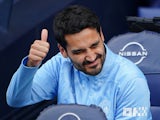 Manchester City's Ilkay Gundogan gestures on the bench on August 24, 2024