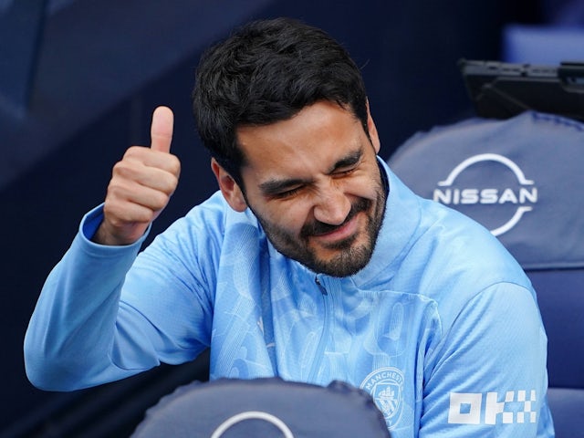 Manchester City's Ilkay Gundogan gestures on the bench on August 24, 2024