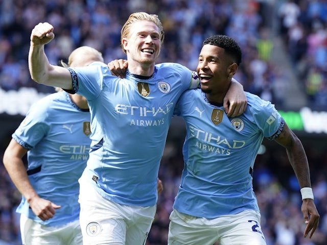 Manchester City's Kevin De Bruyne celebrates scoring their second goal with Savinho on August 24, 2024