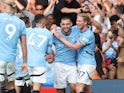 Manchester City's Mateo Kovacic celebrates scoring with Kevin De Bruyne and Phil Foden on August 18, 2024