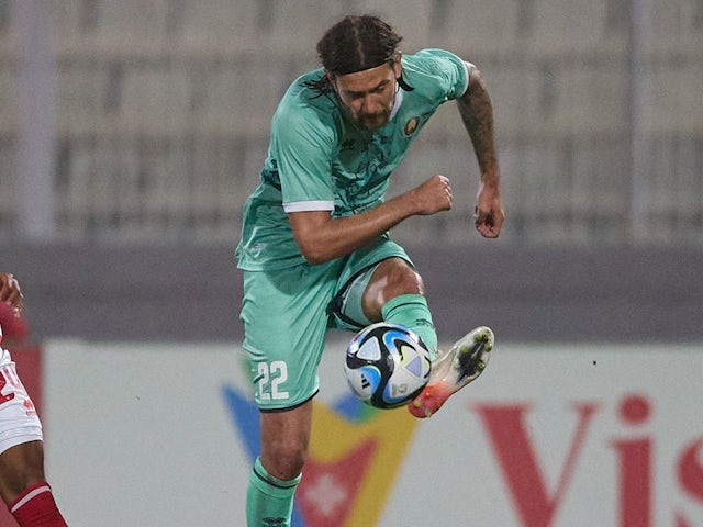 Pavel Zabelin strikes the ball during his team's game against Malta on March 26, 2024