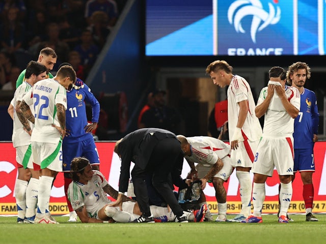 Riccardo Calafiori receives treatment for an injury while representing Italy on September 6, 2024.