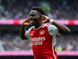 Bukayo Saka celebrates scoring for Arsenal against Tottenham Hotspur on April 28, 2024