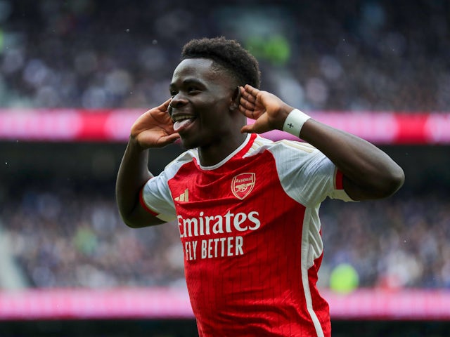 Bukayo Saka celebrates scoring for Arsenal against Tottenham Hotspur on April 28, 2024