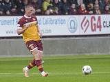 Dan Casey of Motherwell passes the ball during the Scottish Premiership match at Fir Park on August 25, 2024