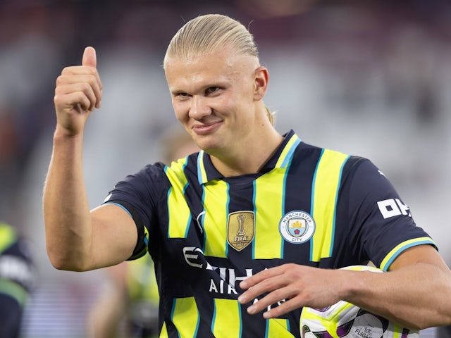 Manchester City's Erling Haaland celebrates with the matchball after scoring a hat-trick on August 31, 2024