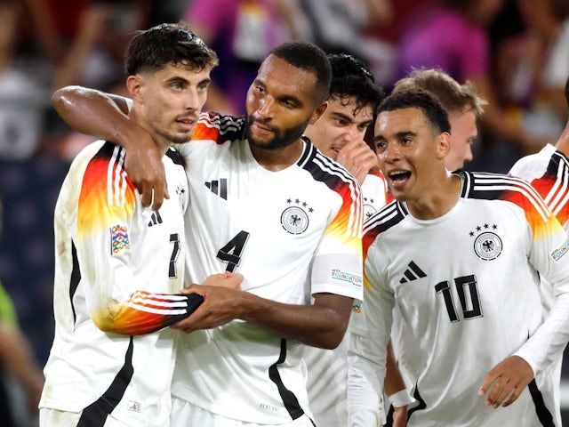 Germany's Kai Howards celebrates with Jonathan Tha and Jamal Musiala on September 7, 2024