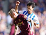 Brighton & Hove Albion's Kaoru Mitoma and Ipswich Town's Sammie Szmodics in action on September 14, 2024