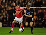 Manchester United's Wes Brown and Barnsley's Adam Hammill battle on October 27, 2009