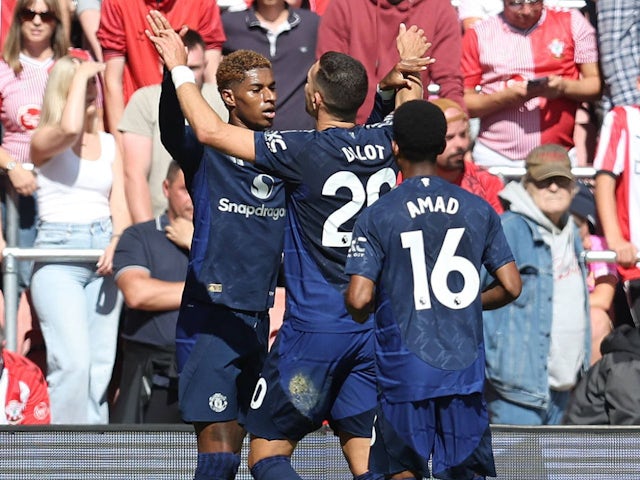 Manchester United's Marcus Rashford celebrates with Diogo Dalot and Amad Diallo on September 14, 2024