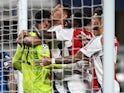 Arsenal players celebrate David Raya's save against Atalanta BC in the Champions League on September 19, 2024