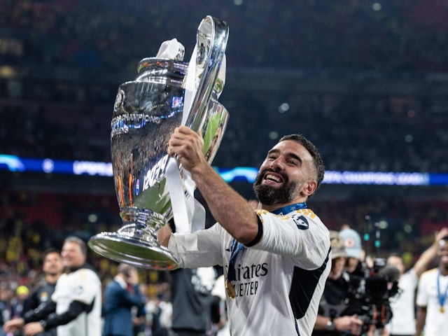 Real Madrid's Dani Carvajal celebrates with the Champions League trophy on June 1, 2024