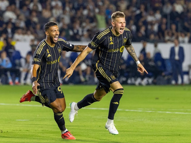 Denis Bouanga and Mateusz Bogusz celebrate a goal for Los Angeles FC on September 14, 2024