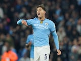 Manchester City's John Stones celebrates scoring on September 22, 2024