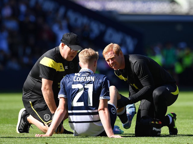 Josh Coburn of Millwall is treated for an injury on September 14, 2024