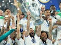 Real Madrid's Karim Benzema lifts the Champions League trophy on May 28, 2022