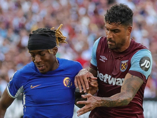 Chelsea's Noni Madueke in action with West Ham United's Emerson Palmieri on August 20, 2023