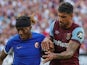 Chelsea's Noni Madueke in action with West Ham United's Emerson Palmieri on August 20, 2023