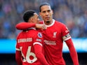 Liverpool's Virgil van Dijk celebrates with teammate Trent Alexander-Arnold on November 25, 2023