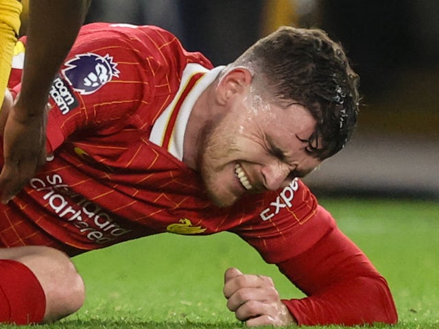 Liverpool's Andy Robertson goes down after sustaining an injury on September 28, 2024