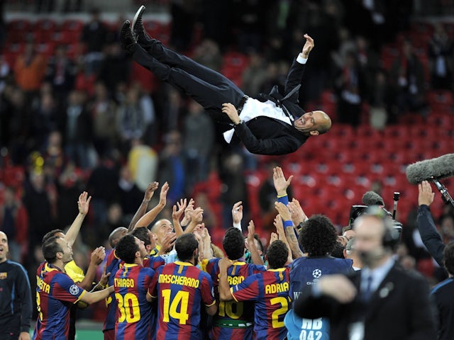 Pep Guardiola celebrating as Barcelona coach in 2011