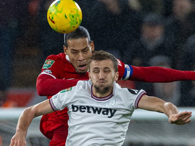 Liverpool's Virgil van Dijk and West Ham United's Tomas Soucek challenge for the ball on December 20, 2023