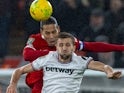 Liverpool's Virgil van Dijk and West Ham United's Tomas Soucek challenge for the ball on December 20, 2023