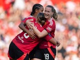 Manchester United Women's Grace Clinton celebrates with team mates Geyse and Elisabeth Terland on September 21, 2024