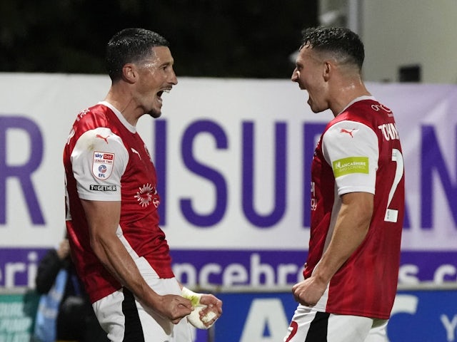 Fleetwood Town's Ronan Coughlan (left) celebrates with Carl Johnston after scoring on September 23, 2024