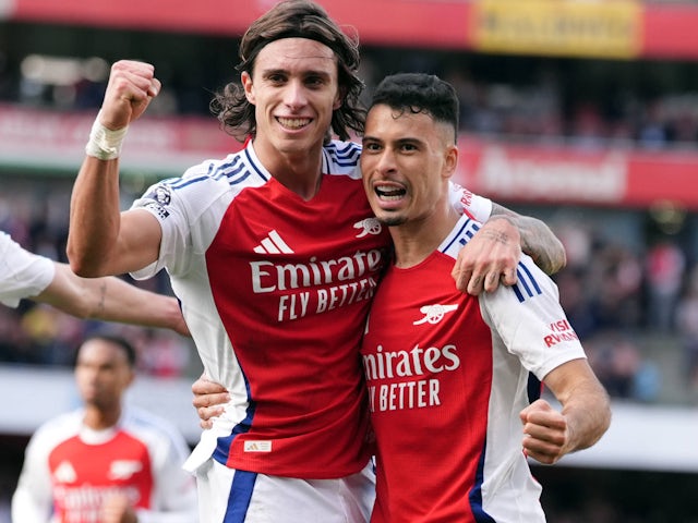 Arsenal's Gabriel Martinelli and Riccardo Calafiori celebrate on September 28, 2024