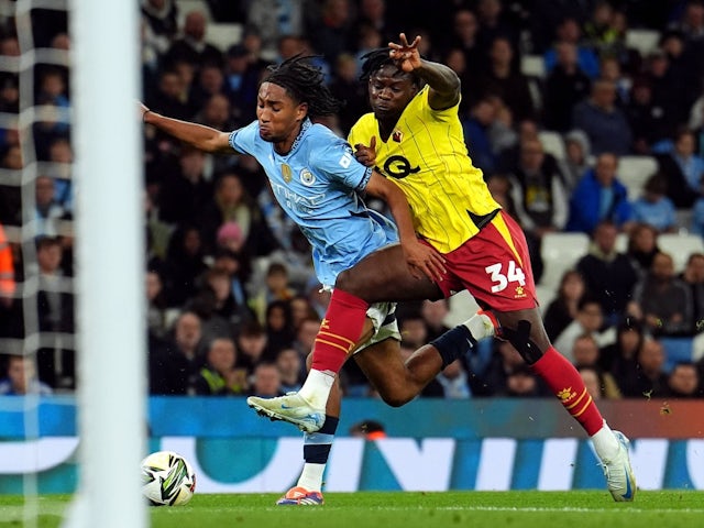 Watford's Kwadwo Baah challenges Manchester City's Kaden Braithwaite on September 24, 2024