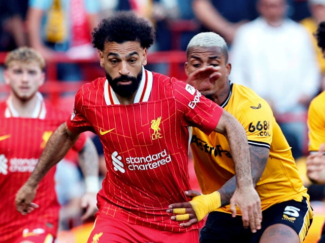 Liverpool's Mohamed Salah in action with Wolverhampton Wanderers' Mario Lemina on May 19, 2024