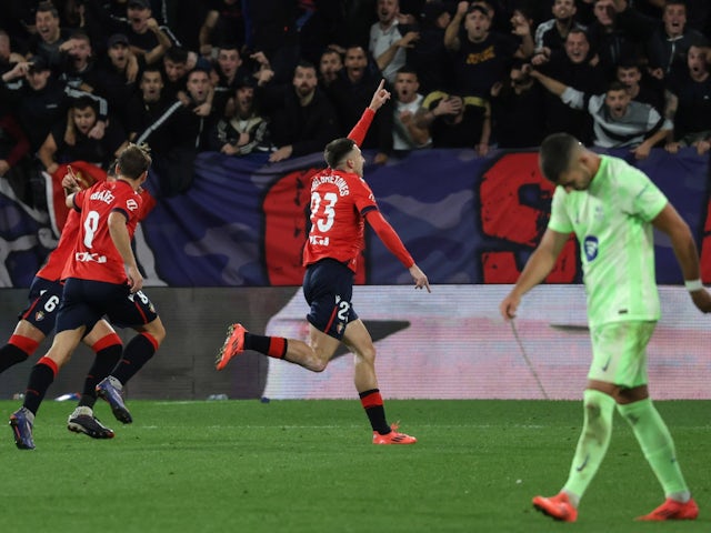 Osasuna players celebrate a goal against Barcelona on September 28, 2024