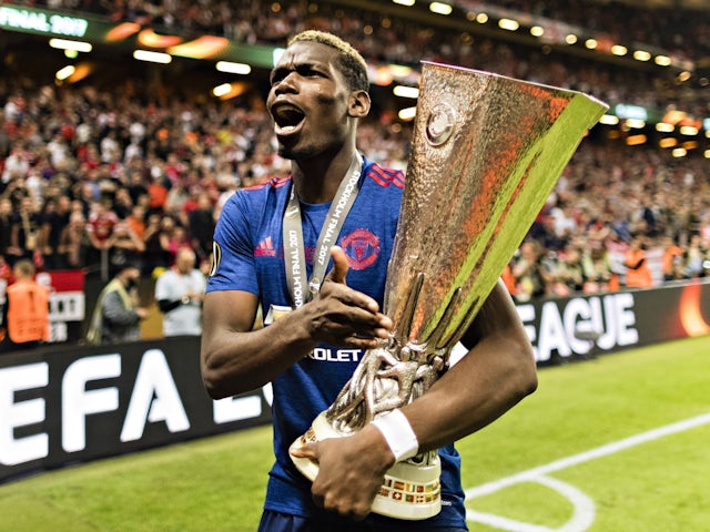 Manchester United's Paul Pogba celebrates with the Europa League trophy on May 24, 2017