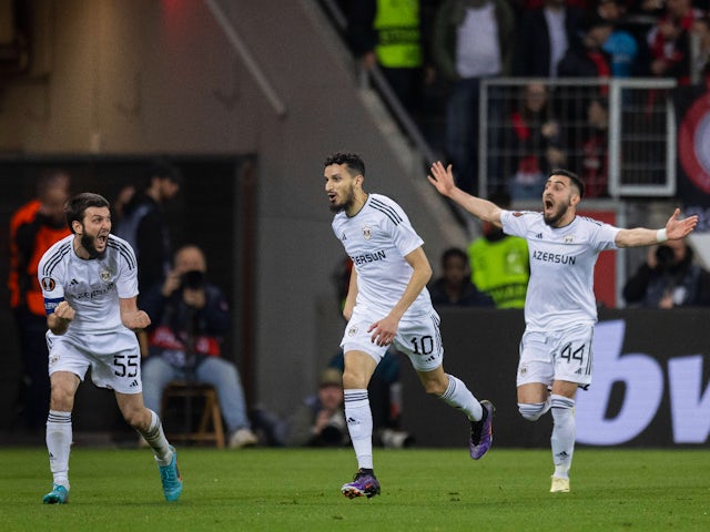 Qarabag's Badavi Huseynov and Elvin Cafarquliyev celebrate Abdellah Zoubir's goal on March 14, 2024