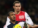 Arsenal's Thomas Vermaelen and Bolton Wanderers' David N'Gog pictured on February 1, 2012