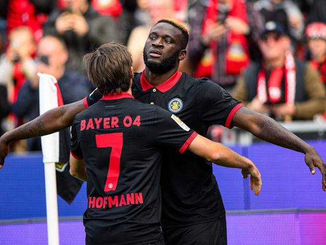 Bayer Leverkusen's Jonas Hofmann and Victor Boniface celebrate on October 5, 2024