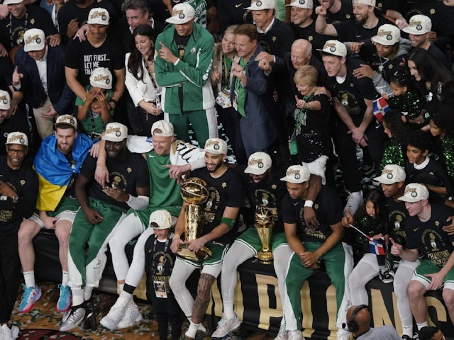 The Boston Celtics pose for a photo after winning the 2024 NBA title on October 2, 2024