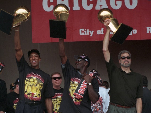  Michael Jordan and Scottie Pippen celebrate winning the NBA with coach Phil Jackson on October 4, 2024