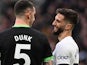 Lewis Dunk of Brighton & Hove Albion and Rodrigo Bentancur of Tottenham Hotspur during the Premier League match on February 10, 2024