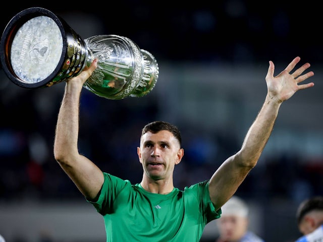 Argentina goalkeeper Emiliano Martinez celebrates with the Copa America trophy on September 5, 2024