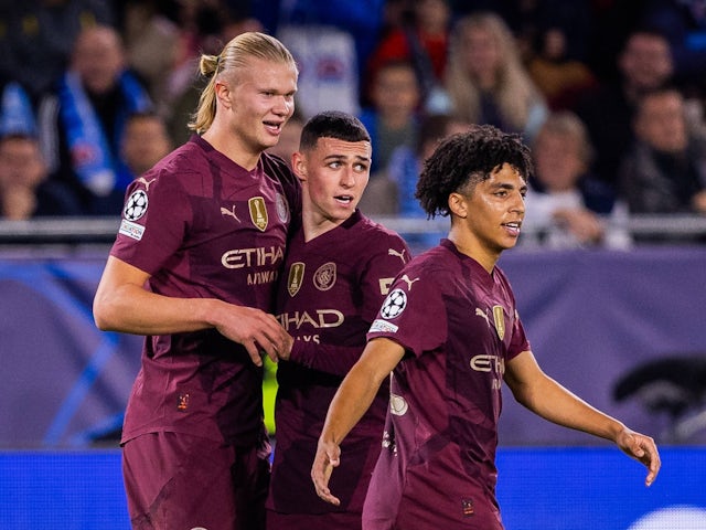 Manchester City's Erling Haaland celebrates with Phil Foden and Rico Lewis on October 1, 2024