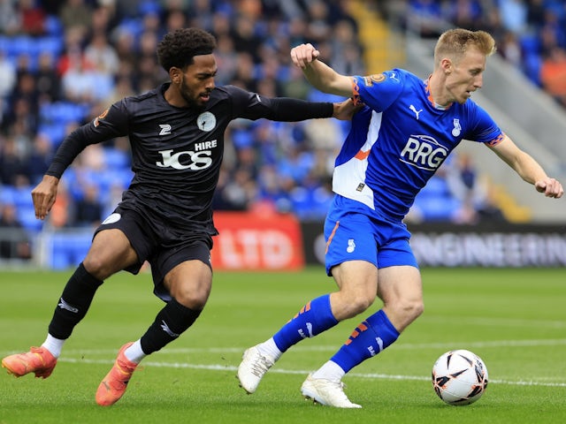 Harry Charsley of Oldham Athletic  tussles with Tyrelle Newton of Gateshead on August 26, 2024