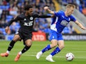 Harry Charsley of Oldham Athletic  tussles with Tyrelle Newton of Gateshead on August 26, 2024