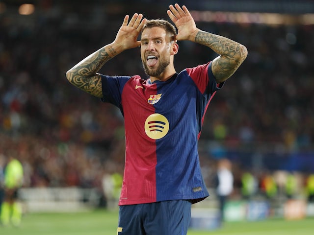 Barcelona's Inigo Martinez celebrates scoring against Young Boys on October 1, 2024