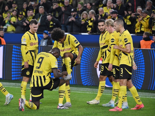 Karim Adeyemi celebrates with his Borussia Dortmund teammates on October 1, 2024