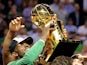 Kevin Garnett of the Boston Celtics celebrates with the NBA trophy in 2008