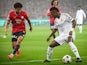 Real Madrid's Vinicius Junior in action with Lille's Tiago Santos on October 2, 2024