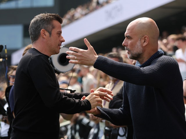 Fulham manager Marco Silva and Manchester City manager Pep Guardiola shake hands before the match on May 11, 2024