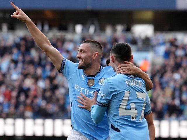 Manchester City's Mateo Kovacic celebrates with Phil Foden on October 5, 2024